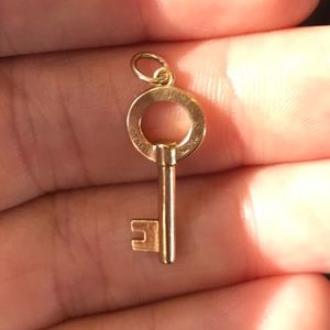 Tiffany & Co. 18K gold open round mini key